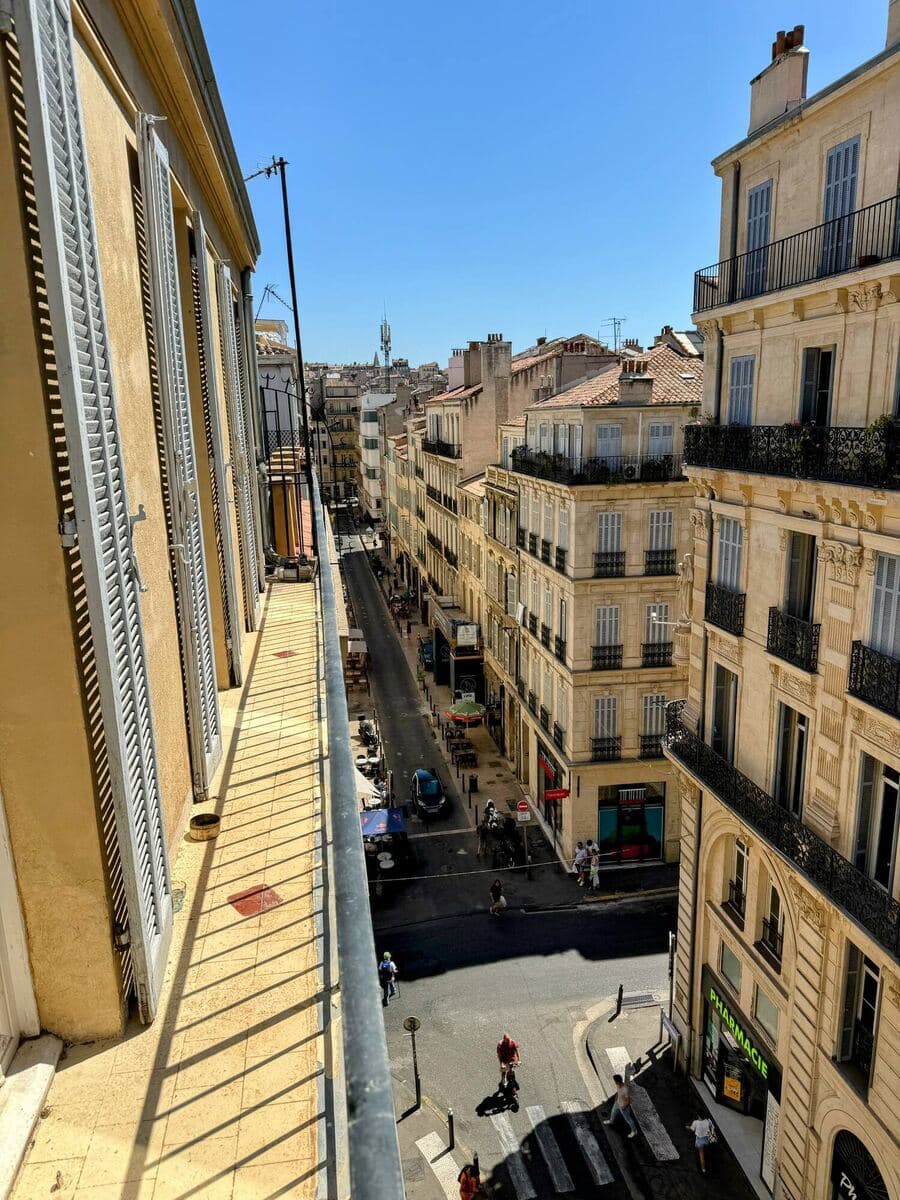 Looking down onto a Marseille street from a balcony in full sun